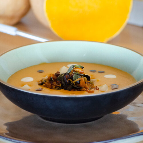 Pumpkin soup with dollops of fresh sheep´s milk cheese